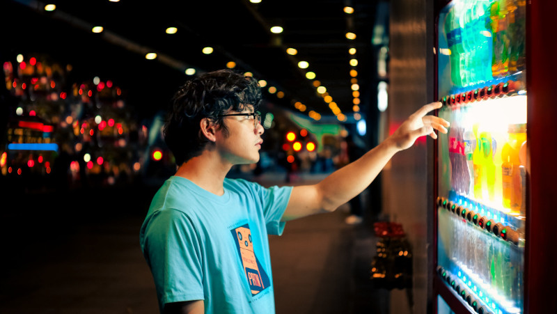 Man and vending machine